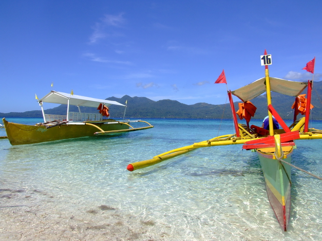 Colorful boat on a tropical beach